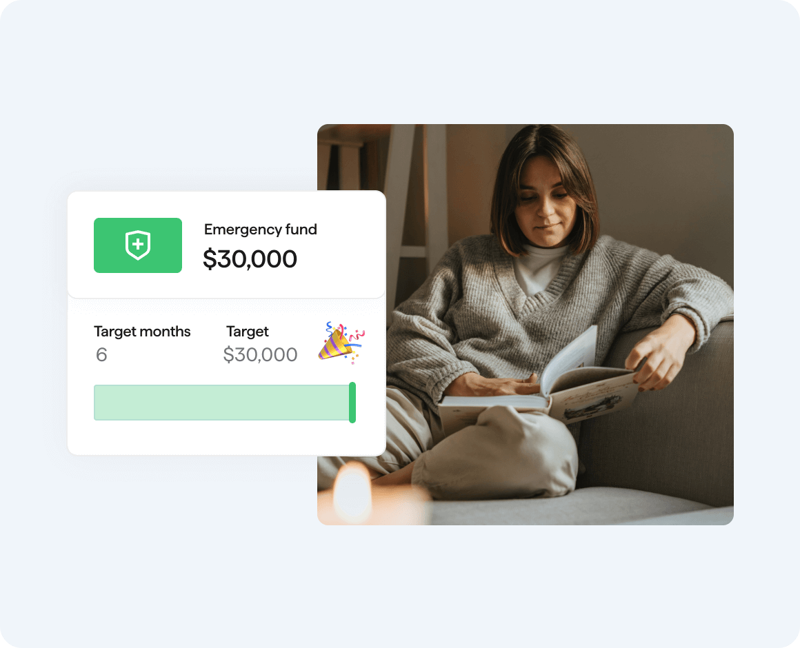 Woman looking at open book with Quicken emergency fund savings goal progress bar user interface is overlayed to the left